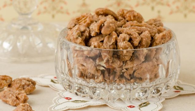 spiced pecans in a glass bowl