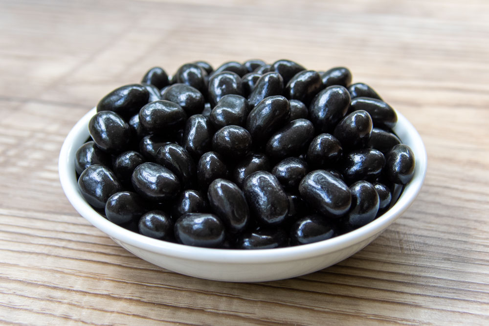 black jelly beans in a bowl
