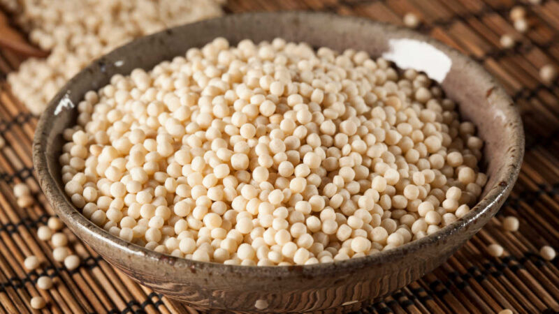 a bowl of uncooked Israeli pearl couscous
