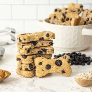 homemade blueberry dog treats on a counter and in a bowl