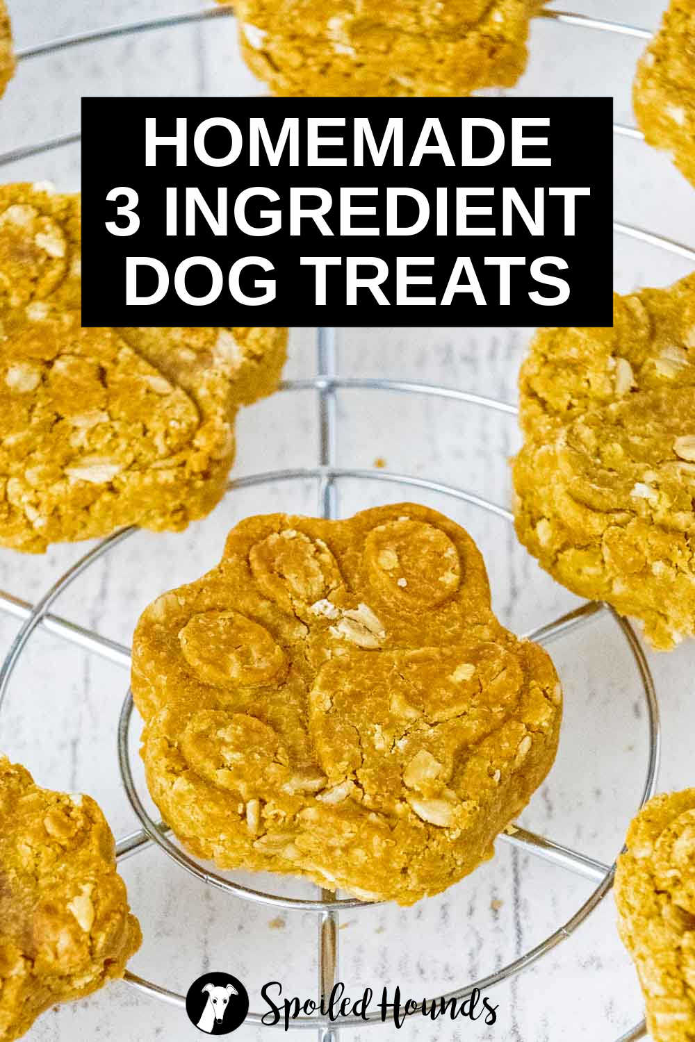 paw shaped 3 ingredient dog treats on a wire rack