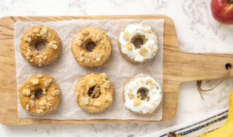 six homemade dog donuts with peanut butter and yogurt icing