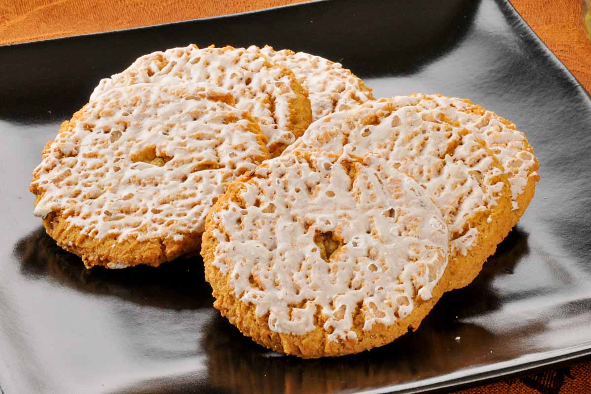 iced oatmeal cookies on a plate