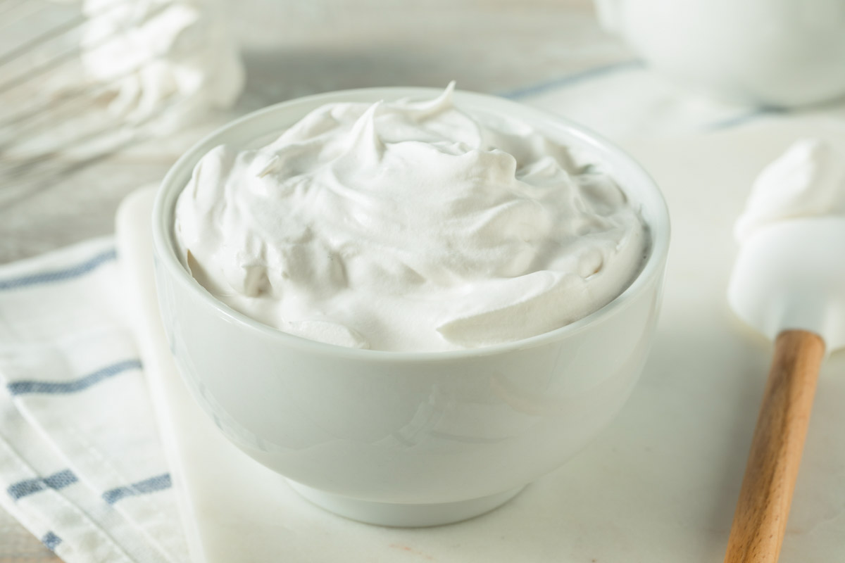 whipped cream in a small white bowl