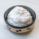 coconut whipped cream in a small dog bowl