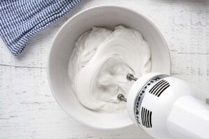 whipping coconut cream with an electric mixer