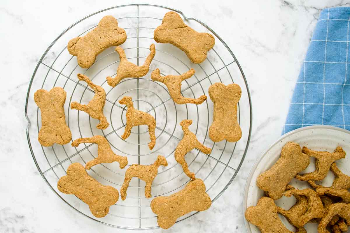 baked peanut butter banana dog treats cooling on a wire rack.