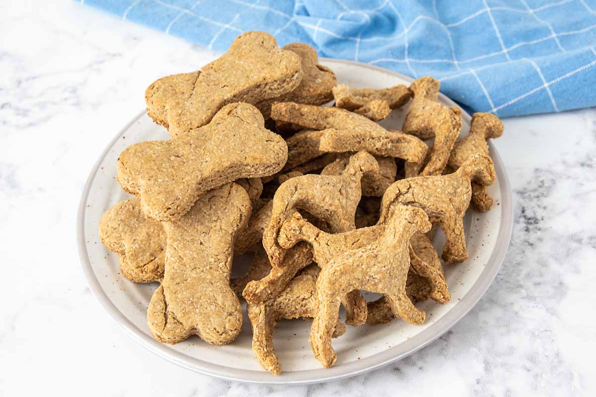 baked homemade peanut butter banana dog treats on a plate.