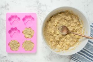 air fryer dog treats dough in a bowl and silicone mold.