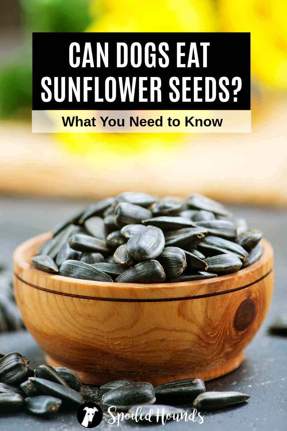 sunflower seeds in a small wood bowl.
