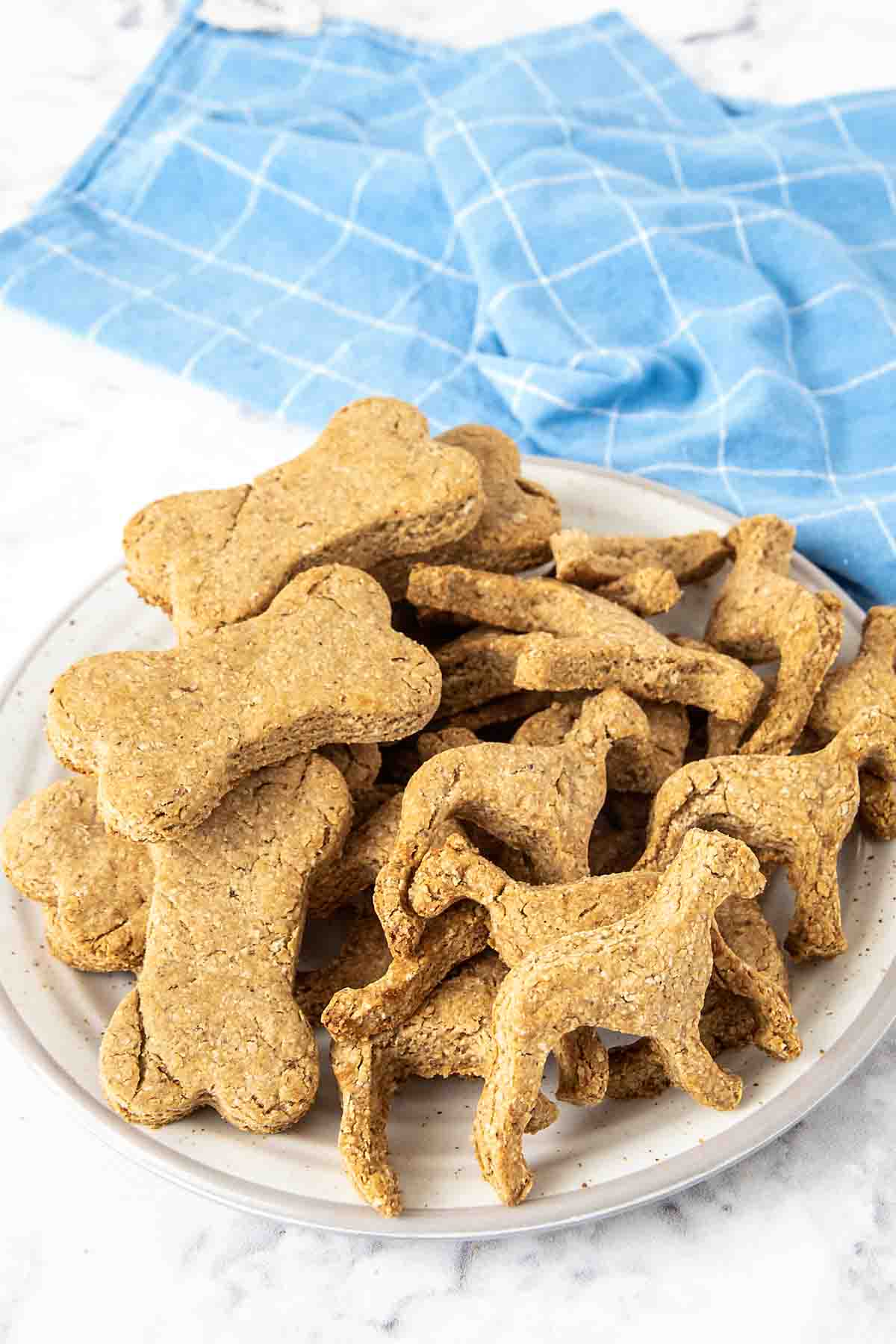 homemade peanut butter banana dog treats on a plate.