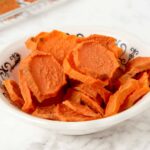 dehydrated sweet potato slices in a bowl.