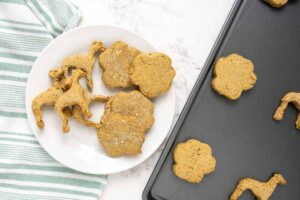 baked dog treats without peanut butter on a plate and baking sheet.