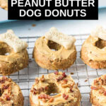 iced peanut butter dog donuts on a wire rack.