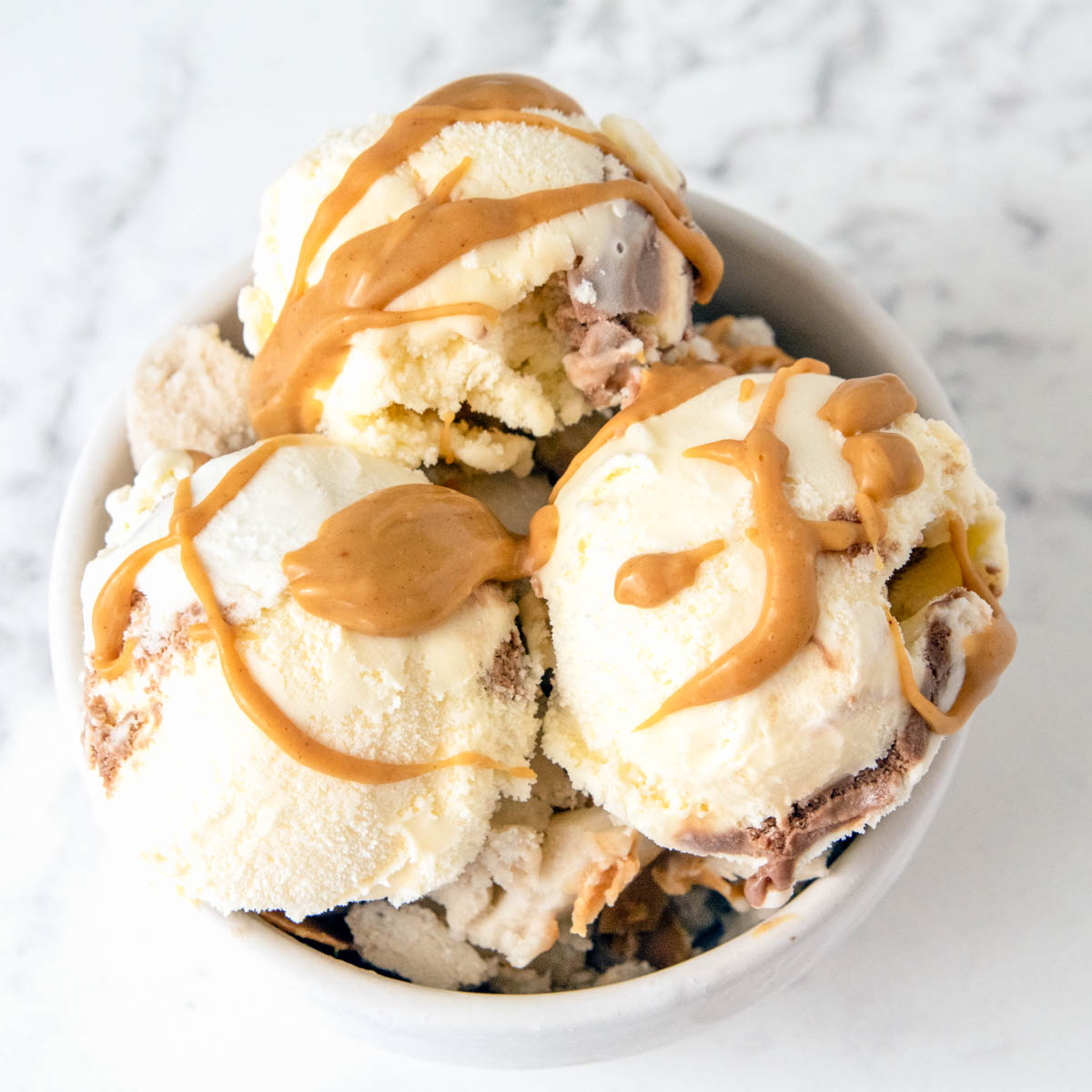 bowl of homemade banana peanut butter swirl dog ice cream.