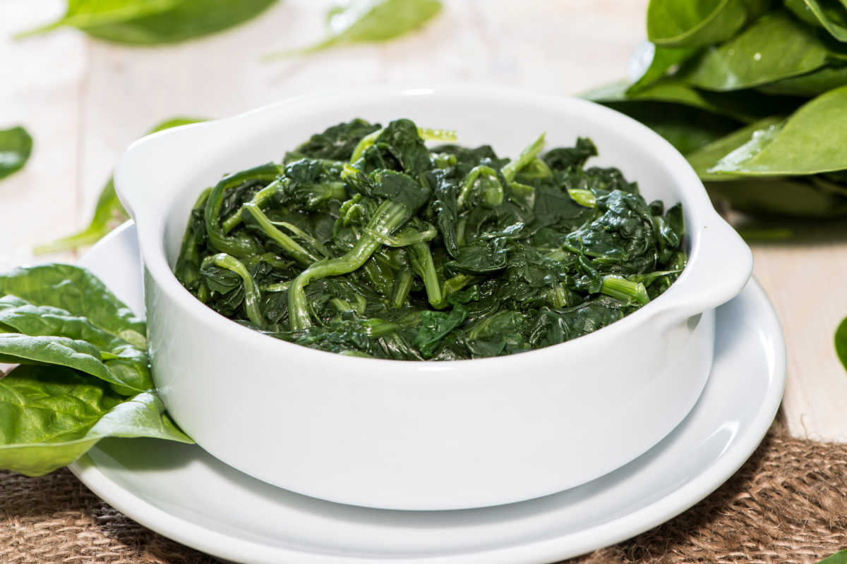 cooked spinach in a bowl.