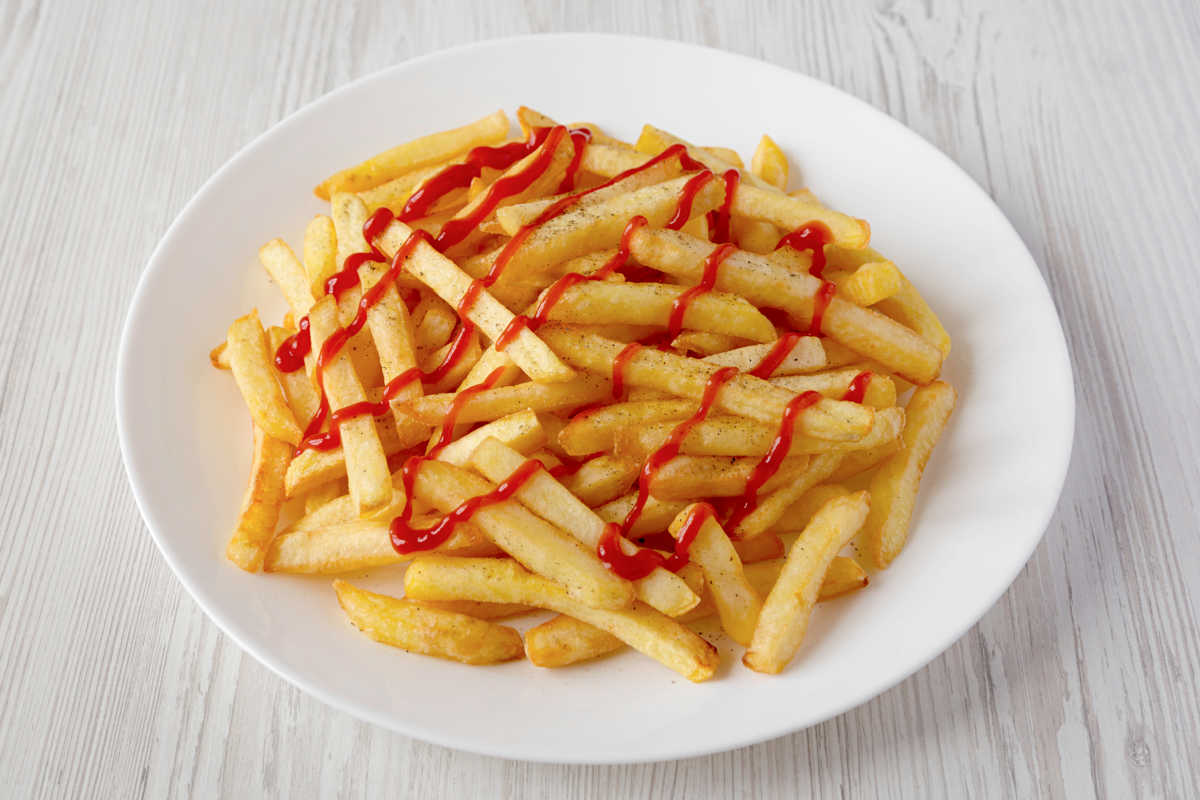 french fries with ketchup on a plate.