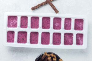 berry mixture in an ice cube tray.