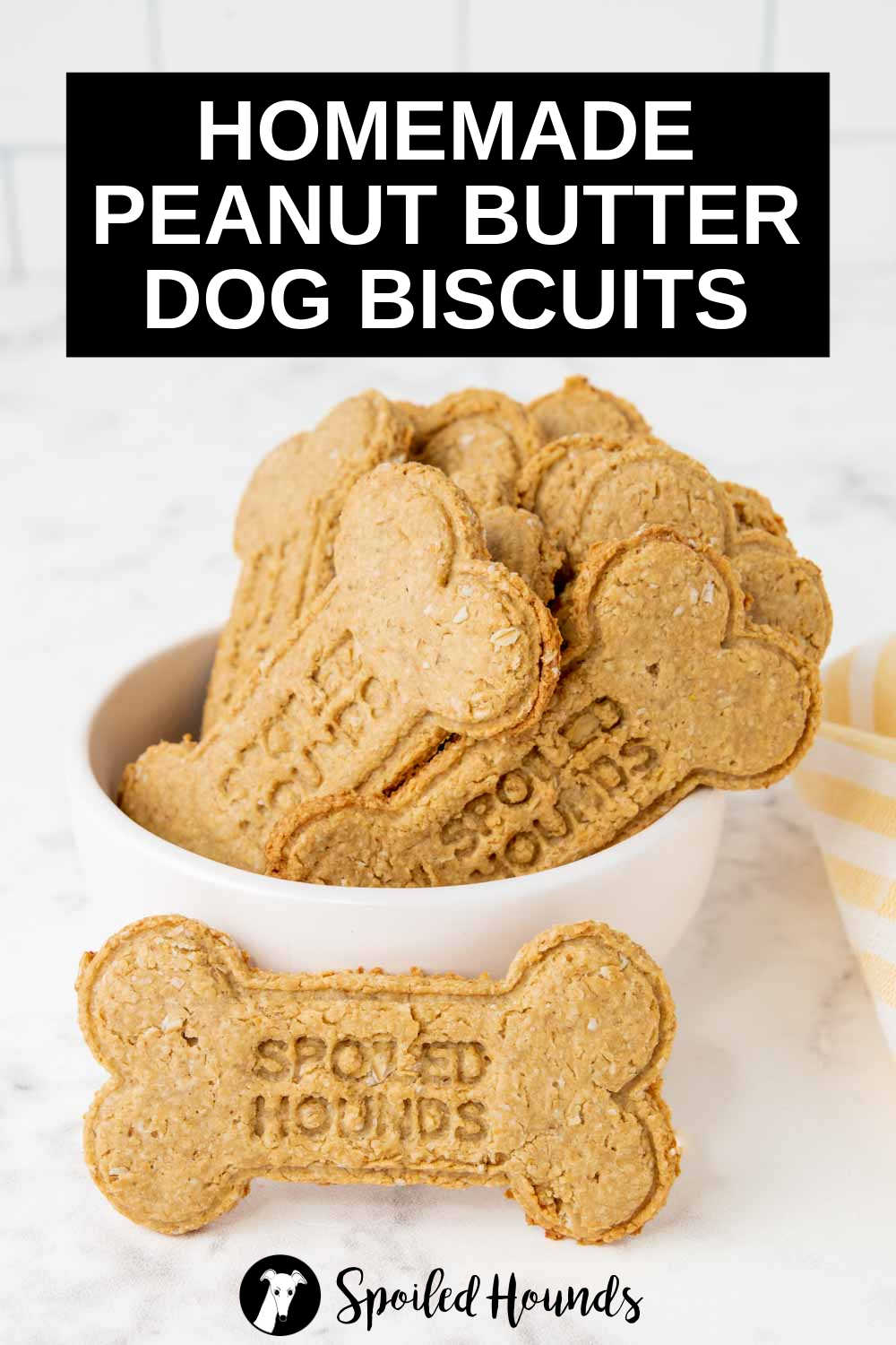 homemade peanut butter dog biscuits in a white bowl.