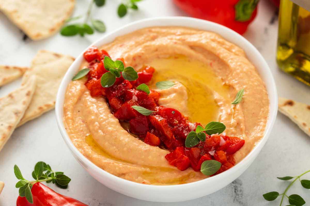 a bowl of roasted red pepper hummus.