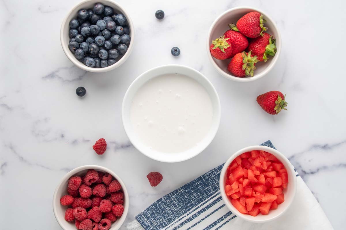 frozen yogurt dog treats ingredients in bowls.