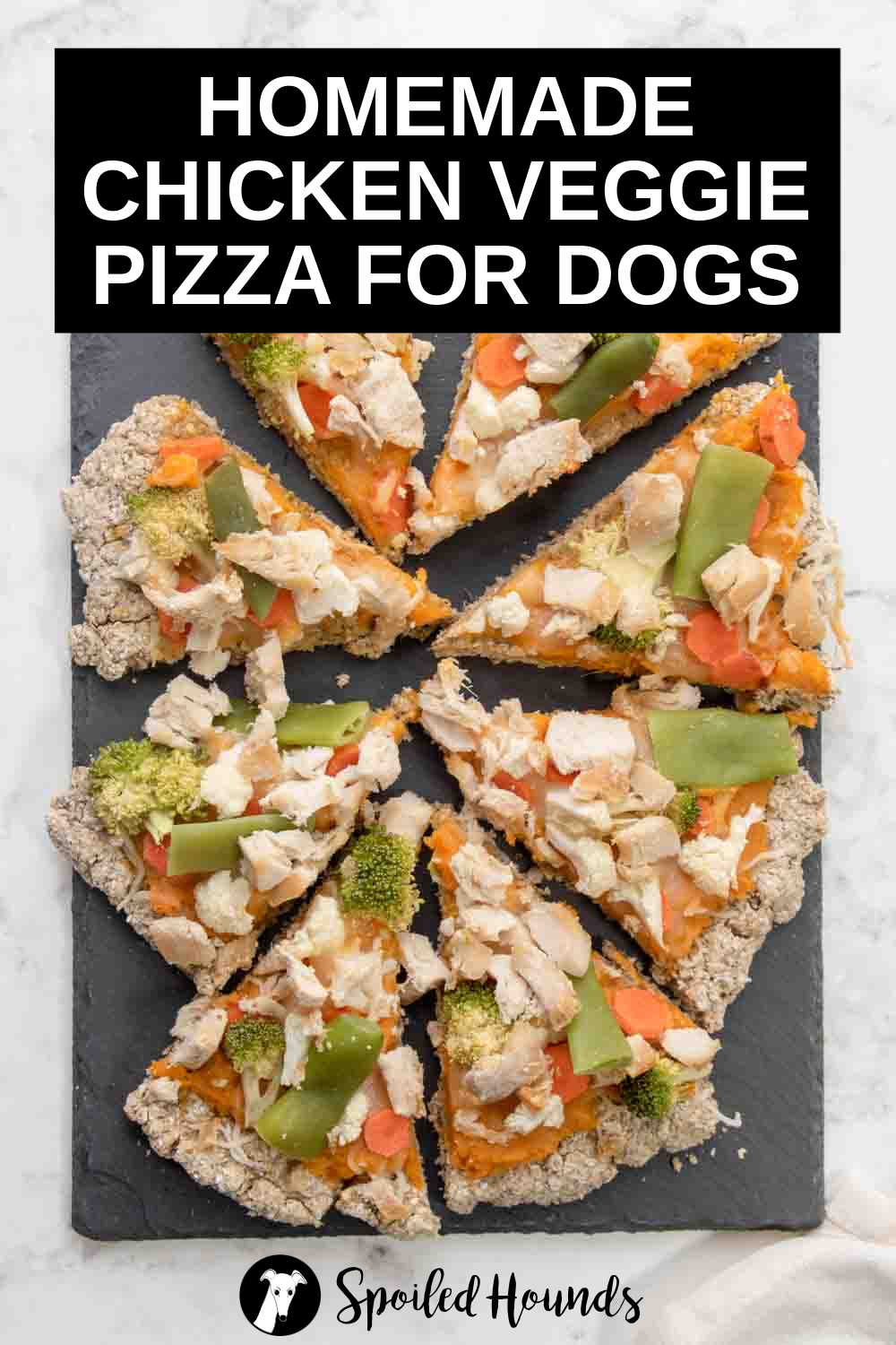 overhead view of sliced chicken veggie pizza for dogs.