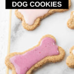 homemade peanut butter dog cookie with pink icing.