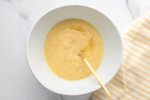 applesauce dog treats wet ingredients mixture in a bowl.