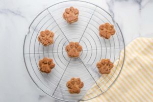 applesauce dog treats cooling on a wire rack.