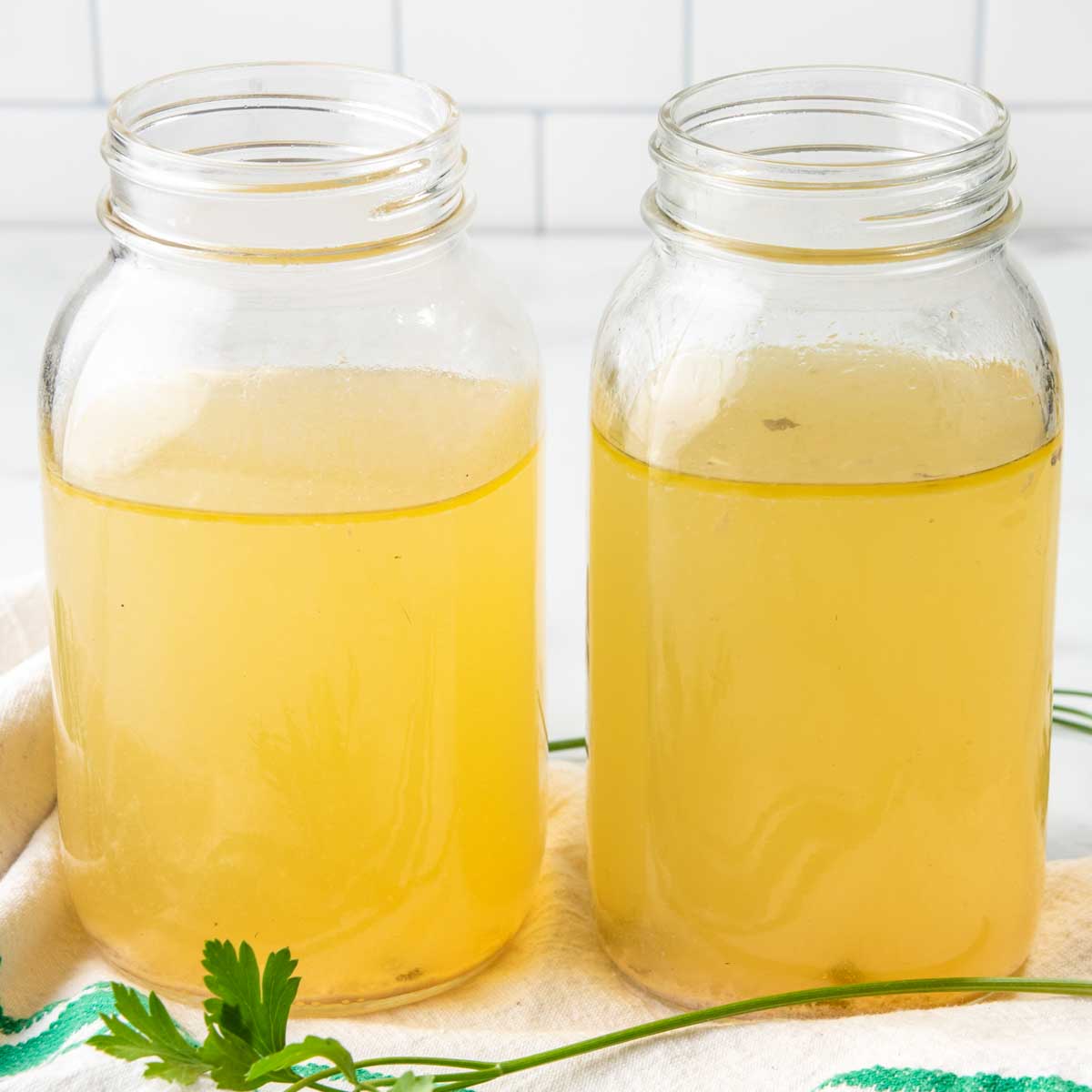 homemade bone broth for dogs in jars.