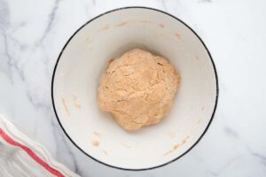 gingerbread dog treats dough in a bowl.