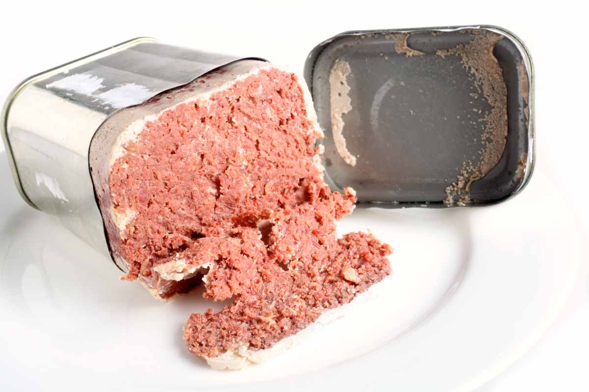 canned corned beef on a plate.