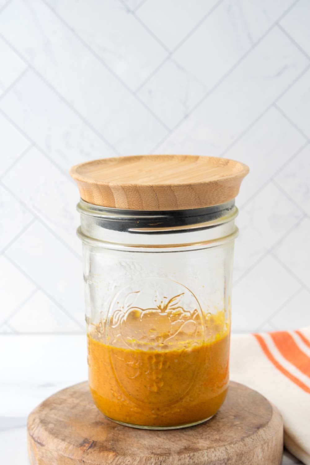 golden paste for dogs in a jar with a wood lid.