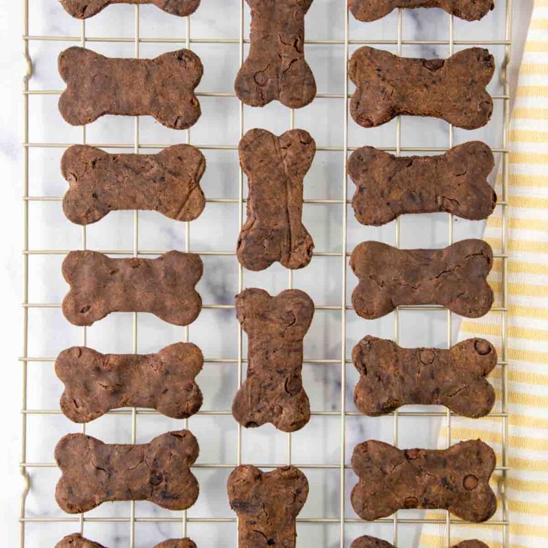 Baked carob dog treats on a wire rack.