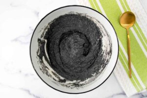 Activated charcoal dog treats batter in a bowl.