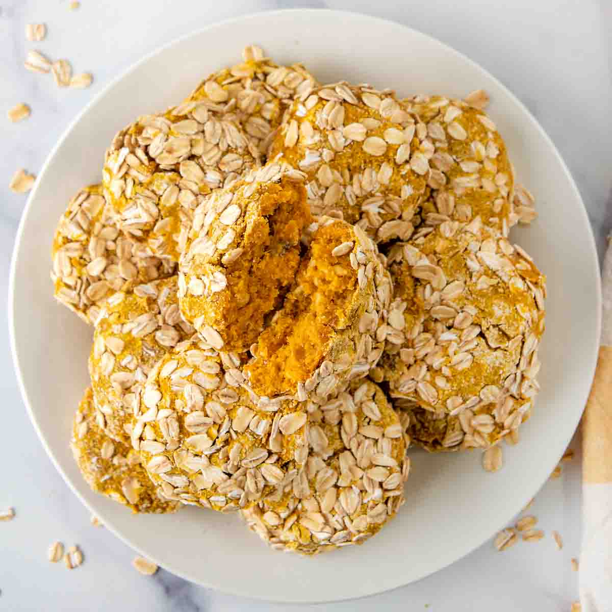 Homemade low fat dog treats on a white plate.