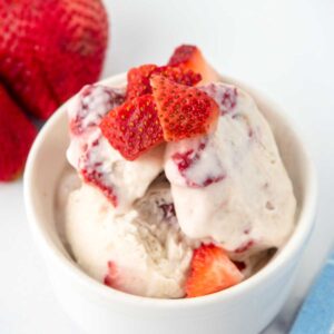 Homemade strawberry banana dog ice cream in a bowl.