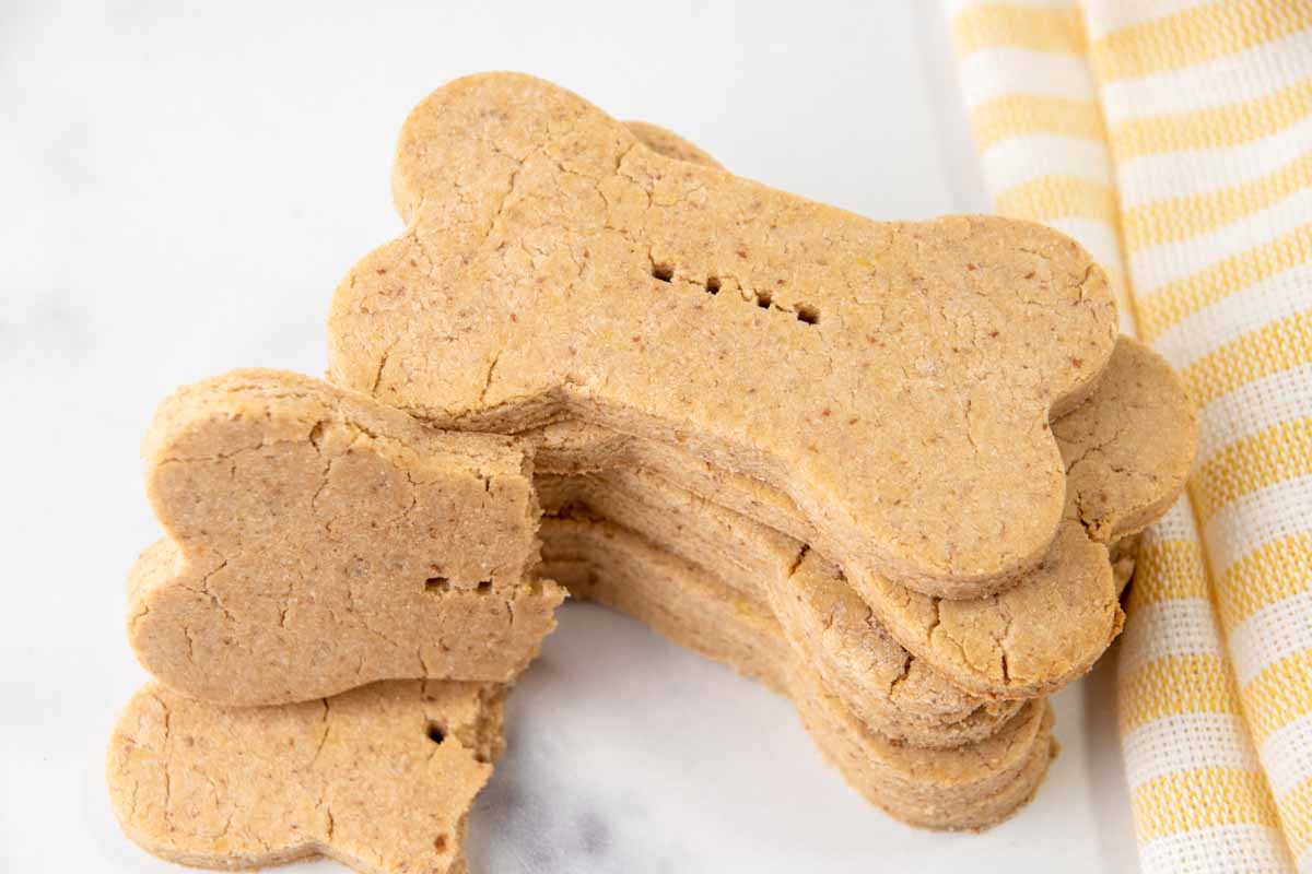 Homemade vegan dog treats in a stack.