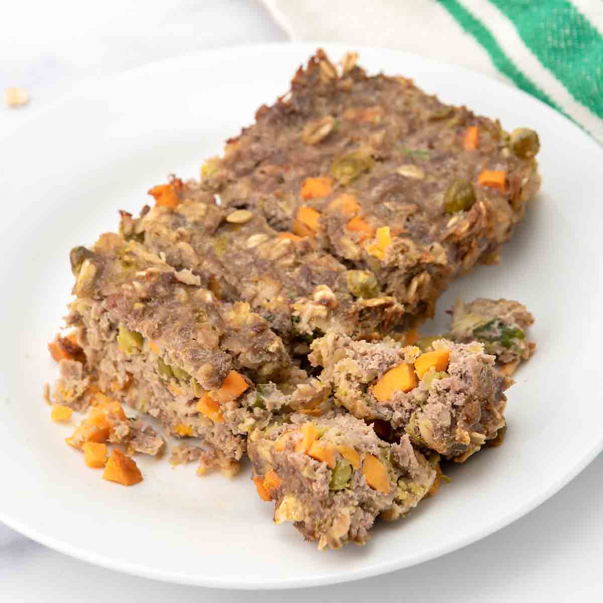 Homemade meatloaf for dogs on a plate.