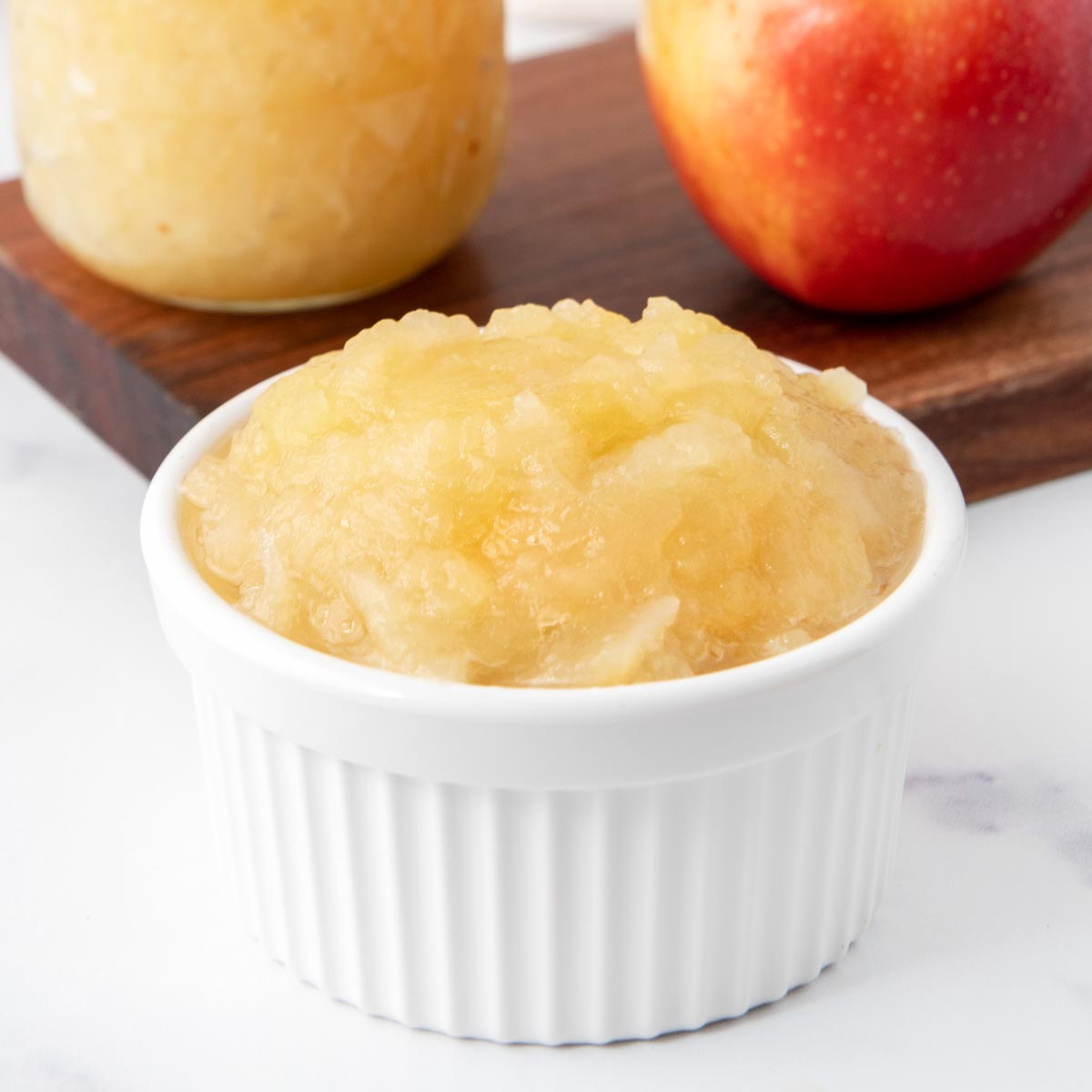 Homemade applesauce for dogs in a ramekin.