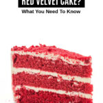 A slice of red velvet layer cake.