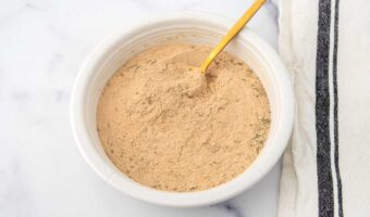 Homemade brewers yeast herb blend for dogs in a bowl.