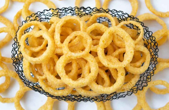 Funyuns onion flavored rings in and around a wire basket.