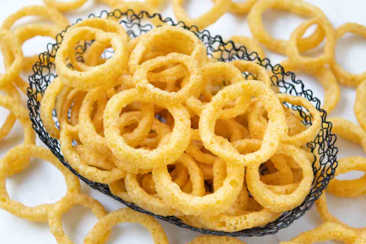 Funyuns onion flavored rings in a wire basket.