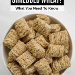 A bowl of mini shredded wheat cereal.