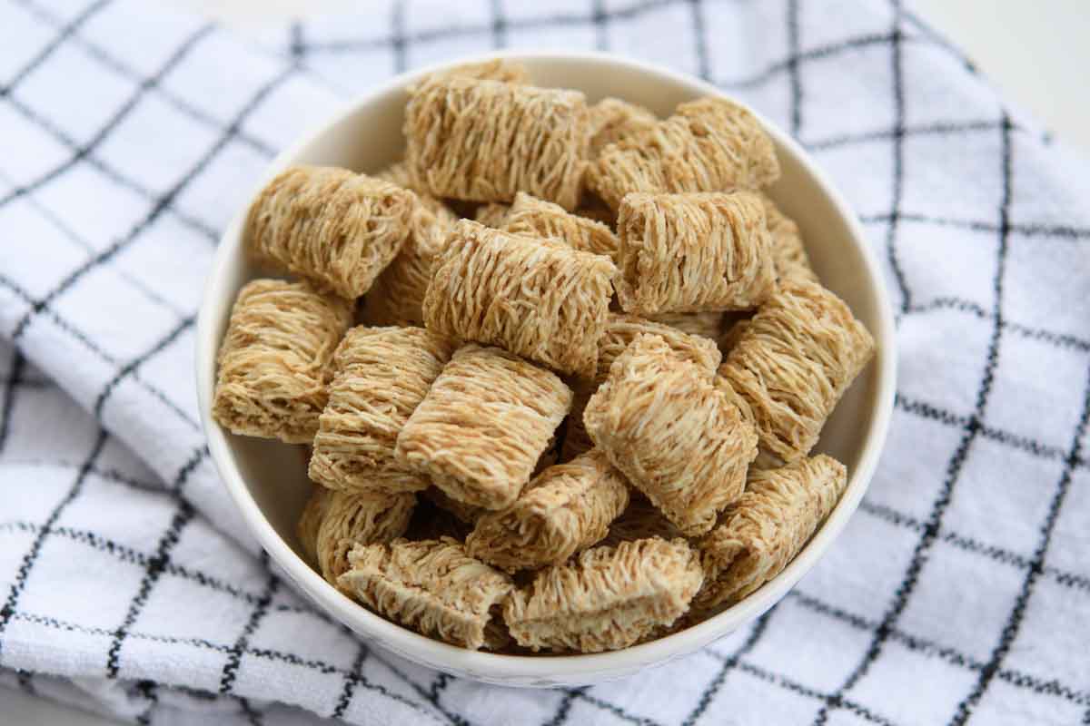 Shredded wheat cereal in a bowl.
