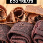 Homemade fruit leather for dogs on a wood board.