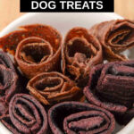 Fruit leather roll ups for dogs in a bowl.