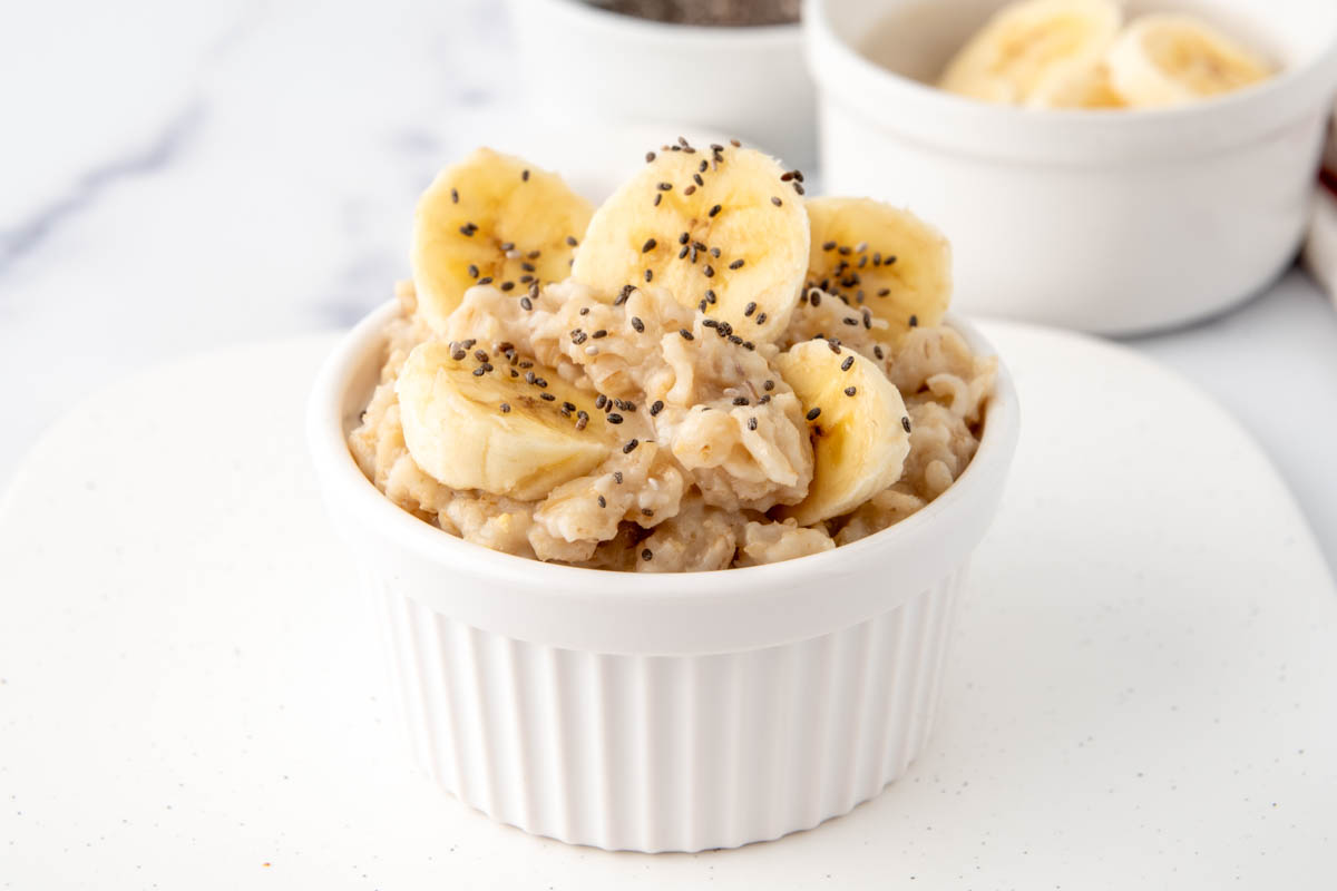 Oatmeal for dogs with bananas and seeds on top.