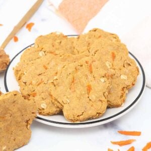 Homemade peanut butter carrot dog treats on a plate.